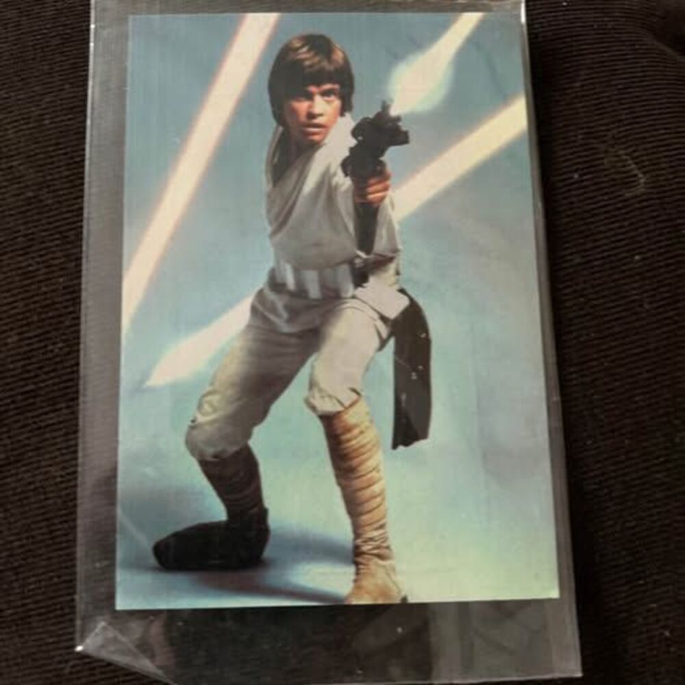 vintage 1977 Star Wars postcard card featuring Luke Skywalker holding a blaster